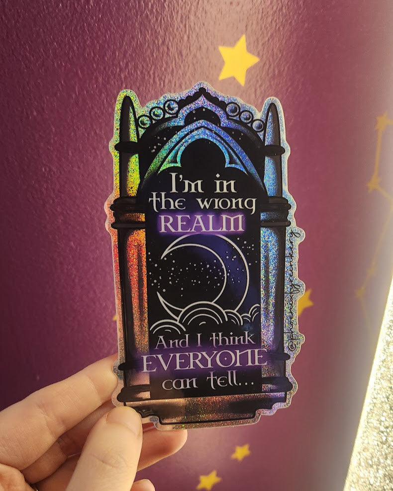 Hand holding a colorful card with text against a purple background with stars